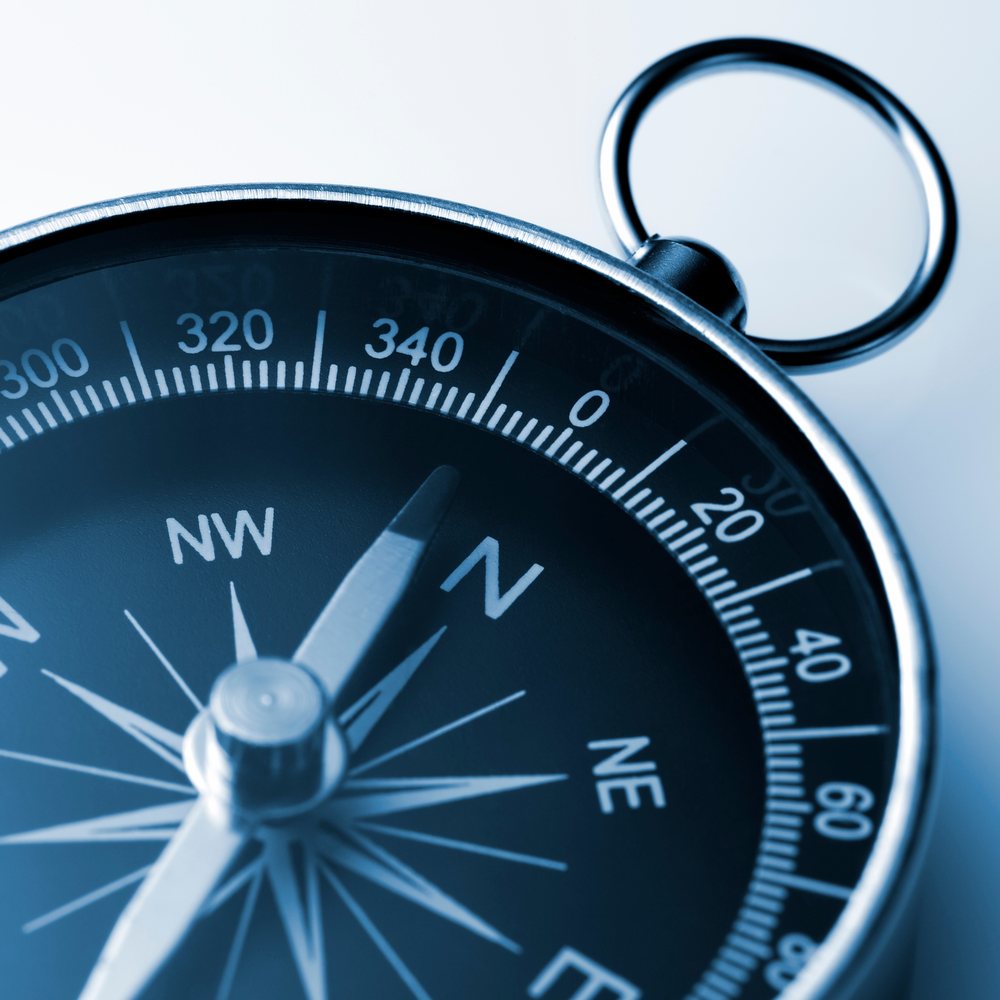 Close-up of a compass, representing reconnecting with your true direction